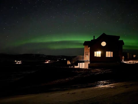 Northern Lights Above — Skylight Views From Bed
