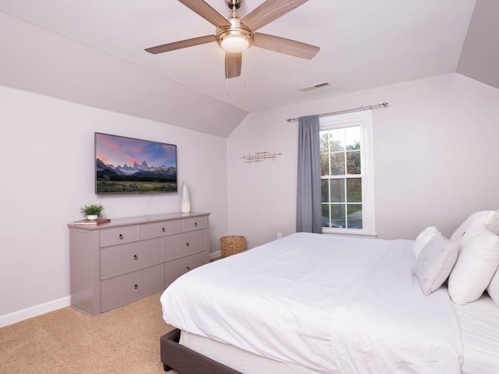 Bright and airy retreat with a large TV and serene views from the window!

