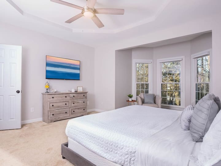 Enjoy peaceful mornings in this bright space with large windows and a smart TV!