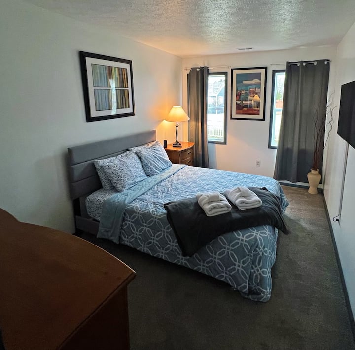 The first floor bedroom is complete with storage and a smart TV