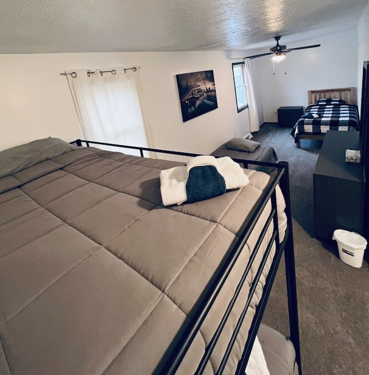 Furnished with a bunk bed, single futon, and a twin.