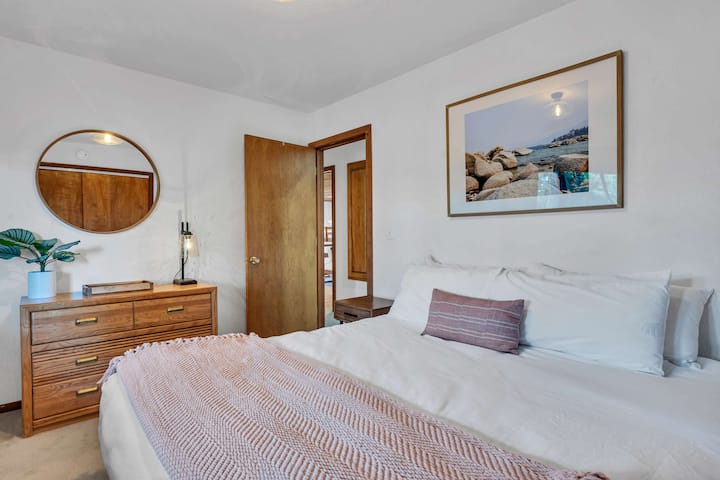 Bedroom 2: King bed, dresser and closet storage, nightstand, mirror