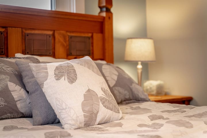Sink into the cozy queen bed surrounded by calming decor.