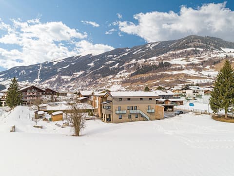 Erfolgreiche Airbnb-Immobilie: Cosy holiday apartment near the ski lift in Bramberg Am Wildkogel
