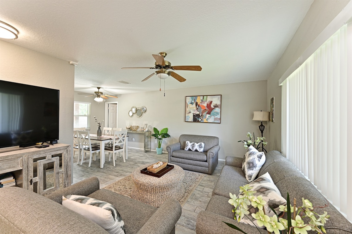 State-Of-The-Art Living Room with Flat Screen TV, Contemporary Décor & Tons of Natural Light