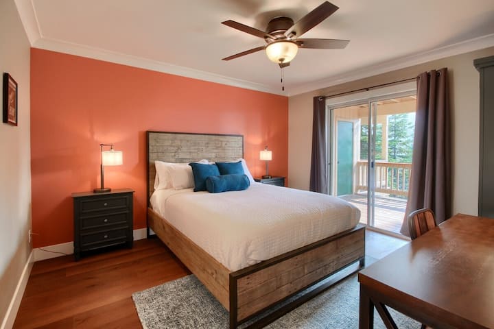 Bedroom 2 (downstairs) with covered patio access (shared with Bedroom 3)