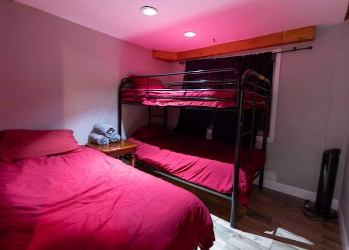 Lower floor bedroom with a bunk bed and a single bed 