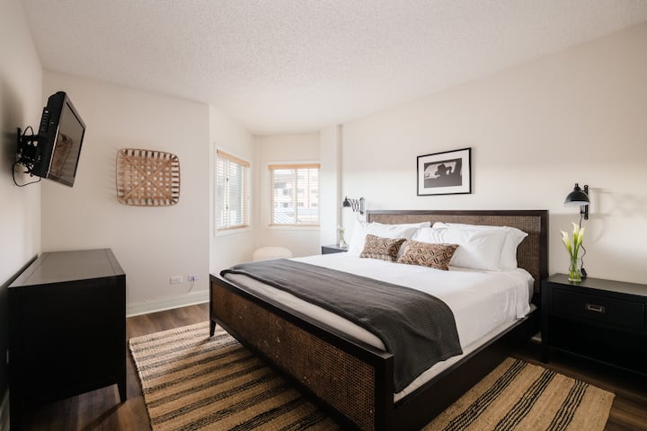 Bedroom 2 features a king bed and television.
