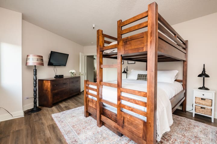 Bedroom 3 is a twin over full bunk bed with a television.
