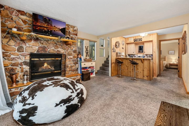 Downstairs 2nd living room.  Bean bag (with mattress inside), wet bar, and queen pull out sofa.  Large entrance to backyard.  Gas operated fireplace on a switch.  Smart TV.