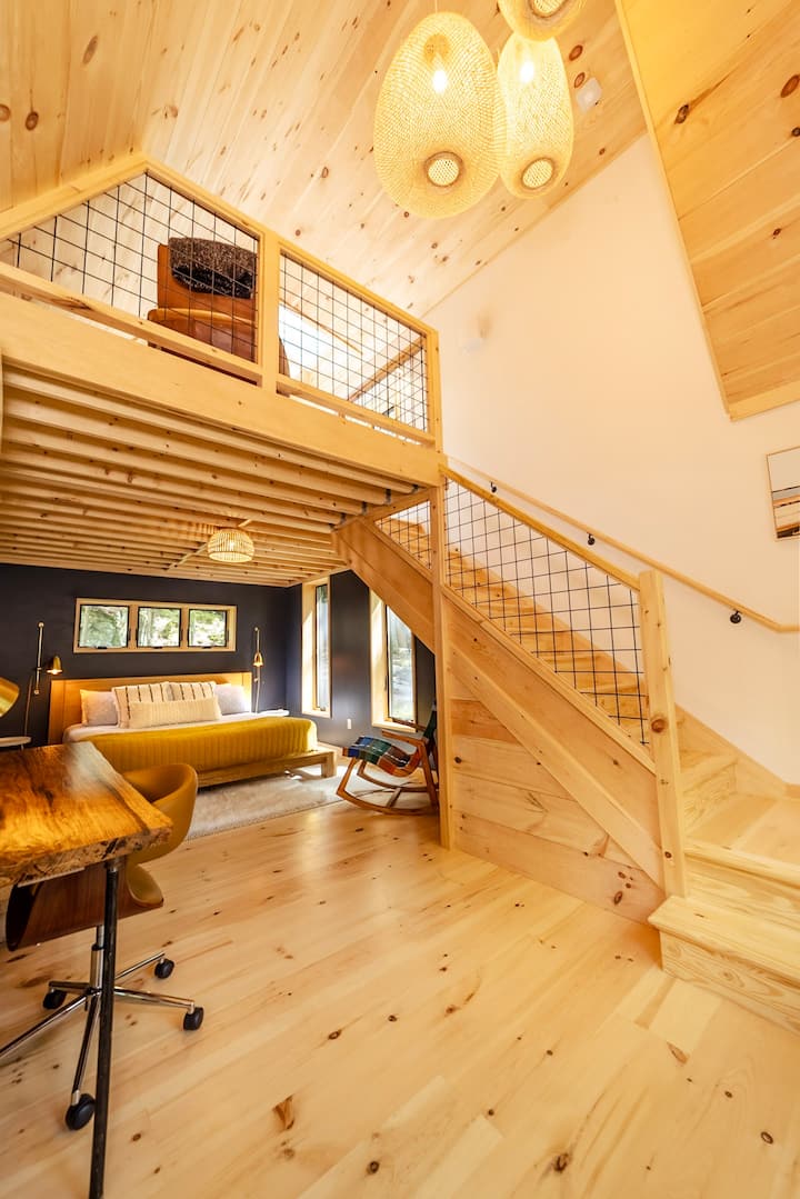 This photo does a great job of showing the layout of the two bedrooms. The loft has a full bed, and is separate from the main bedroom, but there are no walls. Just like to give folks the heads up in case that's not ideal for your group!