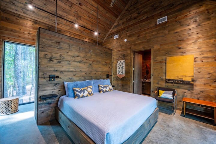 Master bedroom suite has a panoramic forest views 