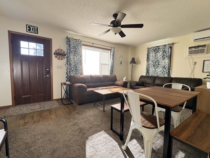 Living room with comfortable seating, sleeper sofa, and TV with streaming services and YouTube TV