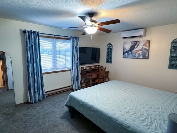 Bedroom #1 with King bed, desk space, and TV with streaming services