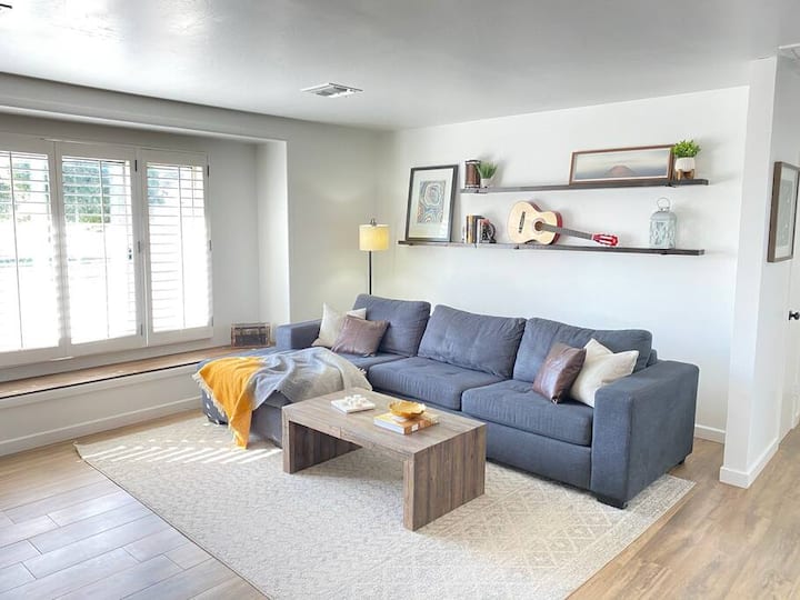 This cozy sectional couch in the living room is perfect for relaxing and watching TV, and it effortlessly converts into a pull-out bed spacious enough for two people.
