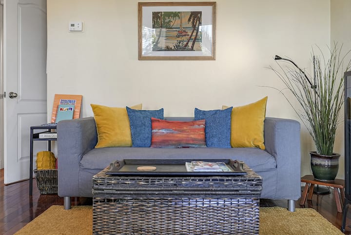 Living Room with provided air mattress and linens in the chest.