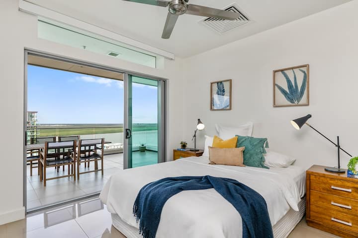Second bedroom with Queen bed, ensuite bathroom, built-in wardrobes and glass doors out onto balcony.