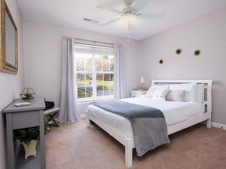 Queen Bedroom 1 is light and airy and overlooks the front of the house.