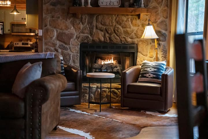 Cozy up by the fire with a good book, or just gaze out at the pines.
