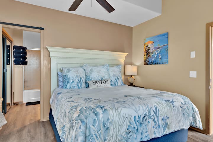 Master bedroom with king bed opens to the balcony overlooking the ocean.