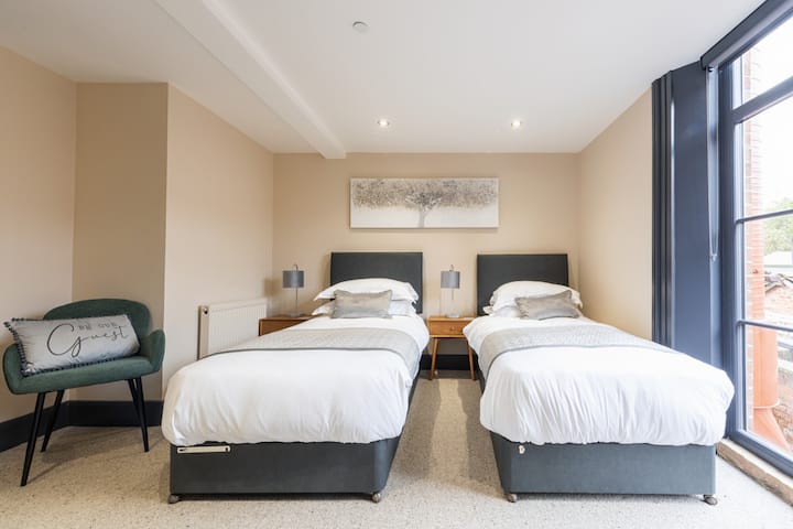 Apartment 2 downstairs bedroom with en suite, guests can request a King size bed or 2 singles. Apartment 1, there is an identical bedroom in Apartment 1