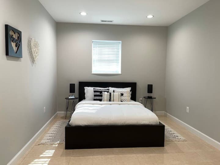 Bedroom 2: another queen-sized bed with a completely monochrome design.