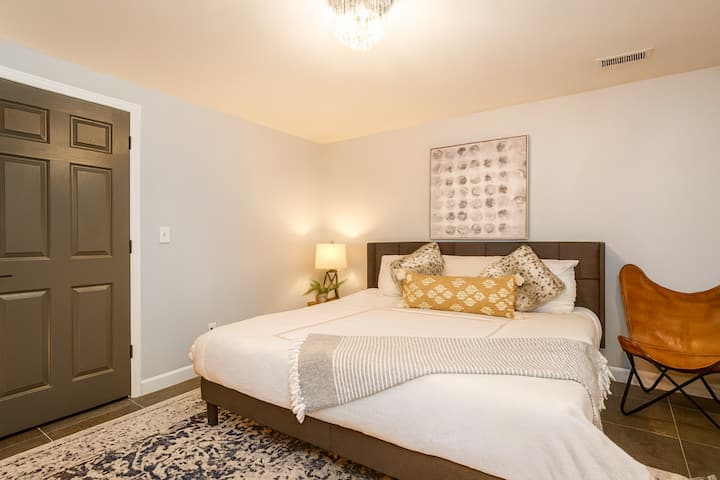 Lower Level King Bedroom With Cozy Decor.