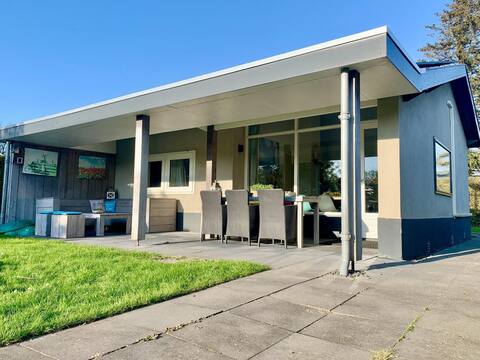 Popular Airbnb listing: Bungalow in Sint Maartenszee with Veranda in Sint Maartensvlotbrug