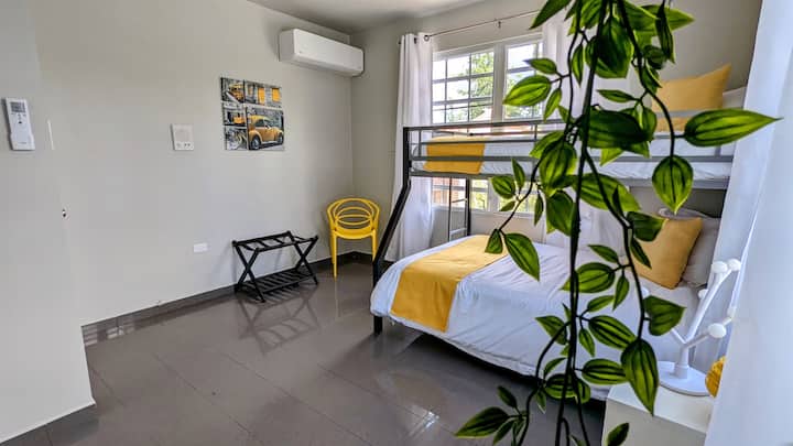 Bunk Room: Fun-filled escape with vibrant decor, natural light, and space for everyone! Bedroom 2. sleeps 3