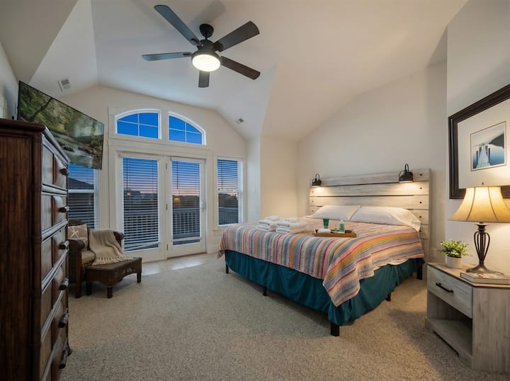 Bedroom 2 — Elegant King Suite with Warm Lighting & Plush Bedding | Comfortable Accommodations for Large Groups at The Hemingway, Outer Banks