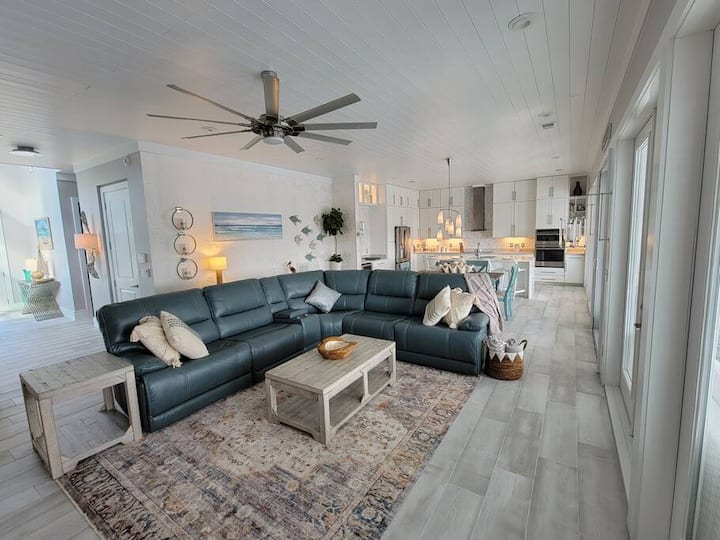 Large living area that views the outdoor pool/patio area.