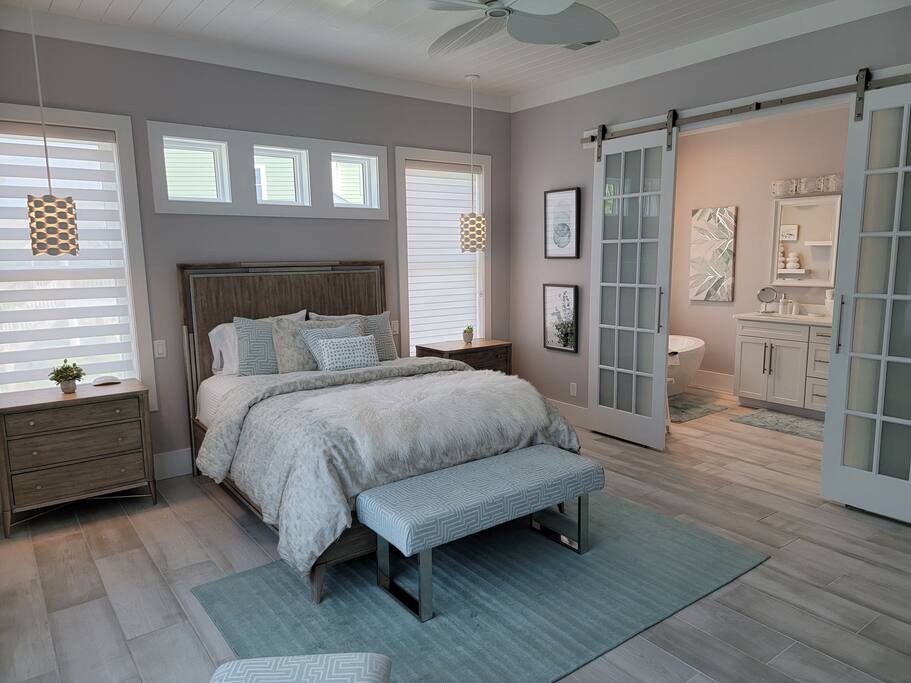Beautiful master bedroom.  All bedrooms have private bath &amp; TV's.