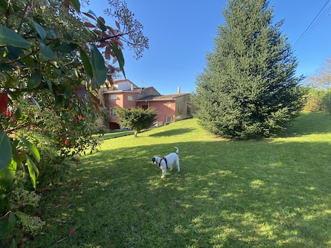 Cottage style house with garden between beach and mountain