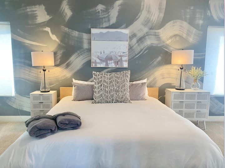 2nd floor suite with king bed, twin bed, electric fireplace, and attached bathroom
