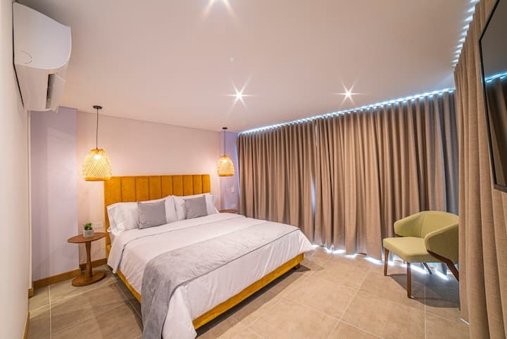 Bedroom 2 with blackout curtains.