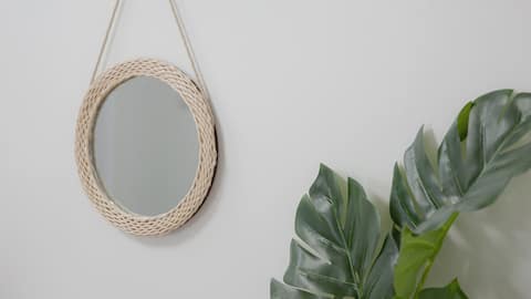 Cozy bedding and neat white-toned interiors blend in