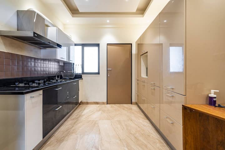 Fully Equipped Gourmet Kitchen for Your Stay featuring Top-of-the-line Appliances and Ample Counter Space.