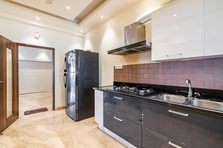 A fully equipped kitchen with modern appliances, perfect for creating culinary masterpieces or enjoying a casual meal.