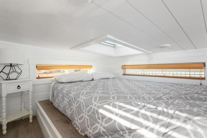 Enjoy a restful night on a comfortable queen-sized bed with soft, crisp linens. The plush mattress provides the perfect balance of support and comfort, ensuring you wake up feeling refreshed and ready to take on the day.