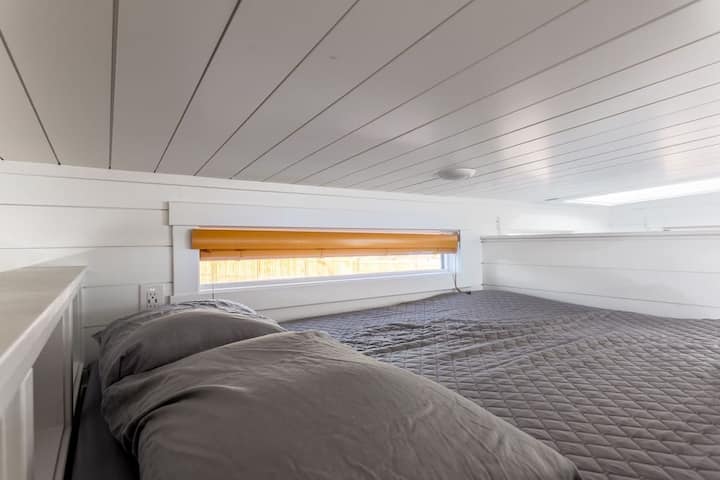 Enjoy a restful night on a comfortable queen-sized bed with soft, crisp linens. The plush mattress provides the perfect balance of support and comfort, ensuring you wake up feeling refreshed and ready to take on the day.