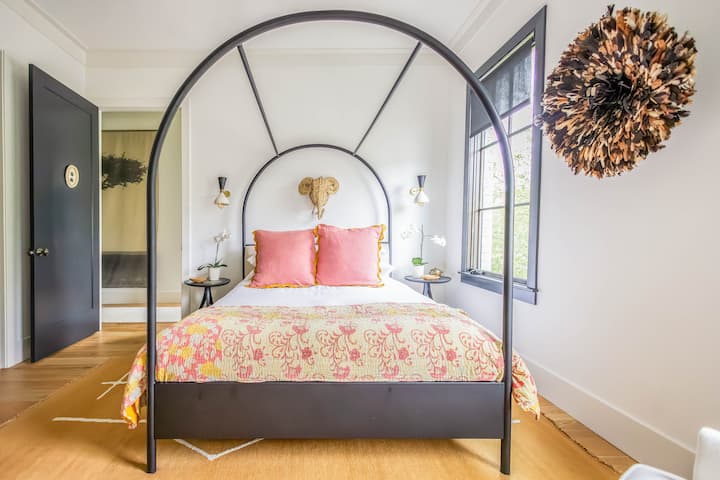 Jill guest room has queen size canopy bed, luxury linen by Quince and Bed Threads, Casper madrac and pillows, walk-in closet, dressing area, reading nook.