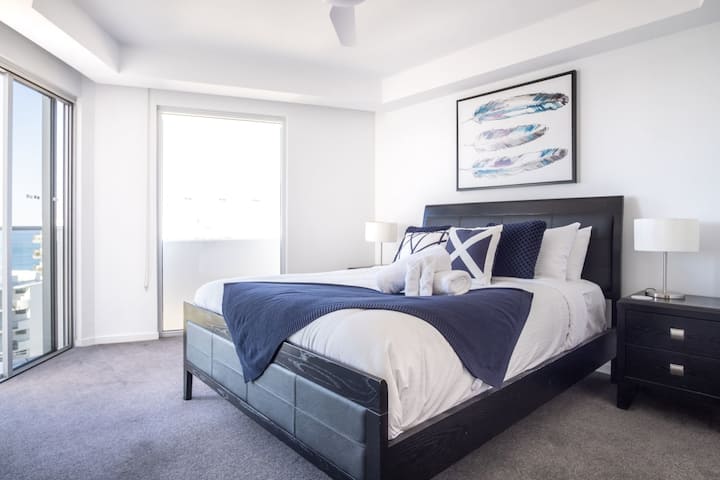 Catch beach views straight from the bed.