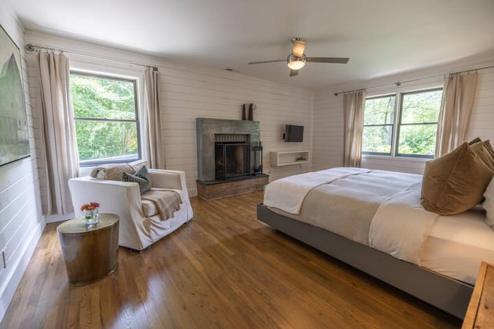 Retreat to your spacious primary suite with a wood burning fire place and comfortable king bed.