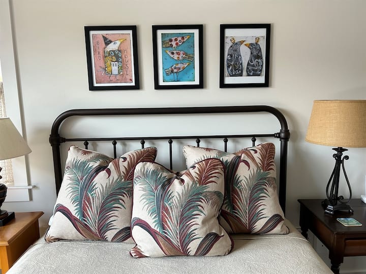 Original local artwork and throw pillows add special ambiance to this house