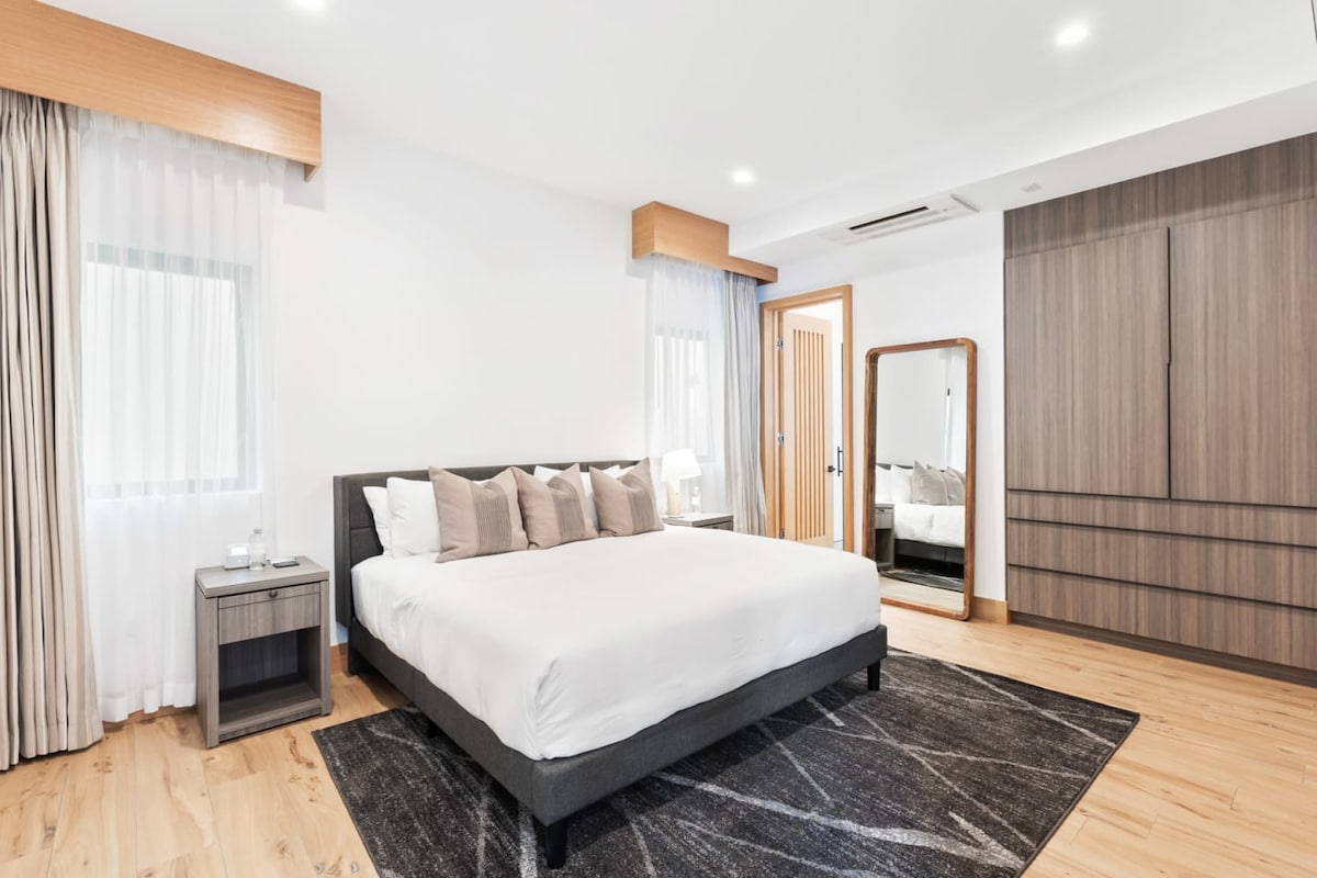 A clean, comfortable bedroom to relax.