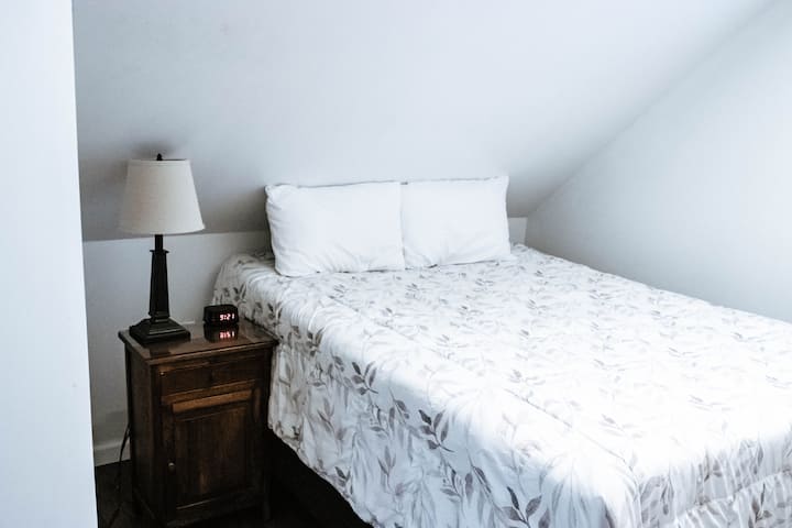 UPSTAIRS: The 3rd bedroom has one queen bed.