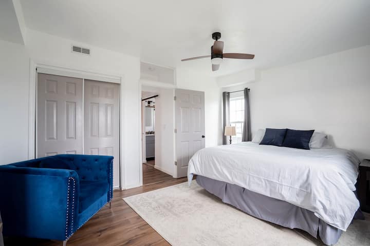 FIRST FLOOR: The master bedroom has a closet with a chest and hangers inside.