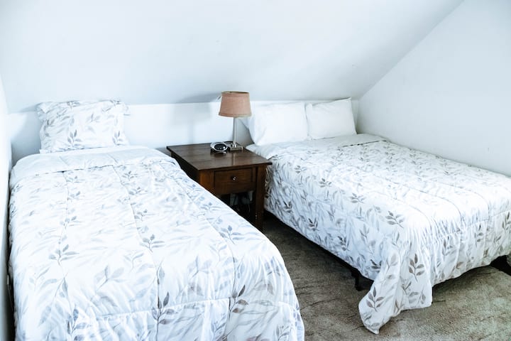 UPSTAIRS: The 2nd bedroom has one full bed and one twin bed.