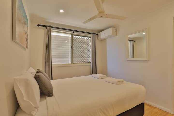 Main Queen Bedroom with Aircon, Built Ins and fan.
