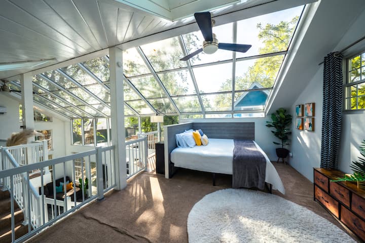 King size bed in the loft of the solarium.